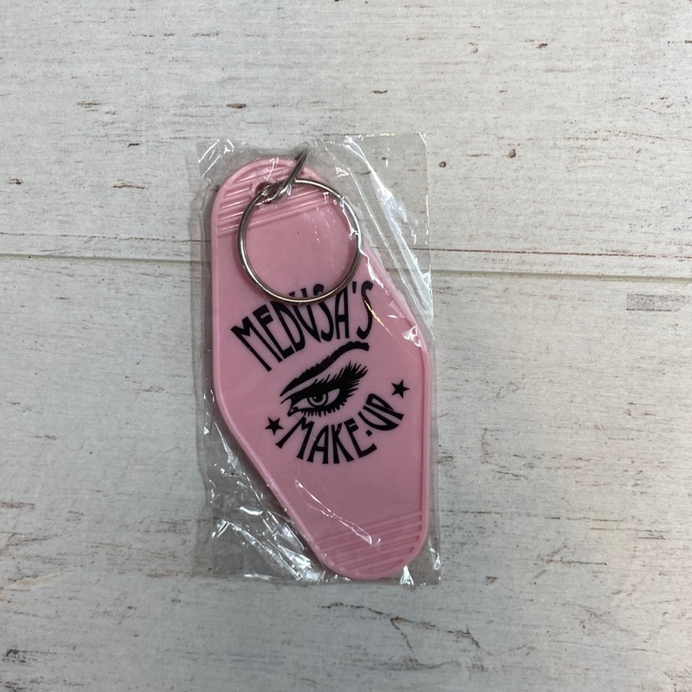 Medusa’s Makeup Light Pink “Escape the Ordinary” Hotel Room Key Chain